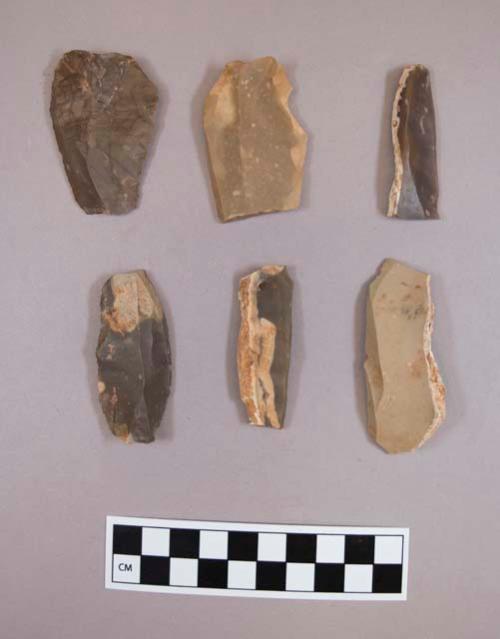 Flint flakes, including tan, brown, grey, pink, cream and red colored stone, some contain cortex