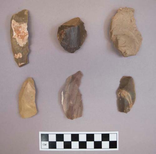 Flint flakes, including tan, grey, cream, purple and brown colored stone, some contain cortex