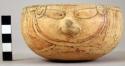 Earthen bowl, painted with face