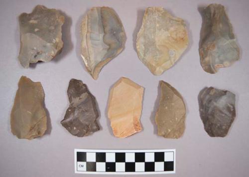 Flint flakes, including grey, tan, purple, brown and cream colored stone, some contain cortex