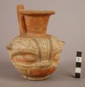 Polychrome pottery effigy jar with spout