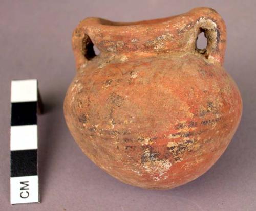 Pottery vessel with handles- red paint with black parallel lines beginning above