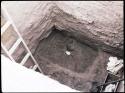 Excavated room, showing ladder, trowel on floor