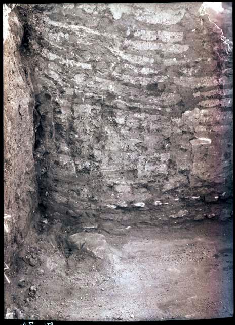 Corner of room, showing masonry wall