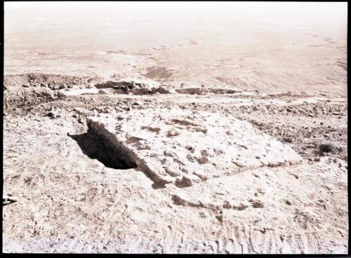 Rectangular elevated area which has been exposed by digging around it; called "citadel" in 36-38