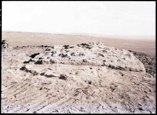 Rectangular elevated area which has been exposed by digging around it; called "citadel" in 36-38