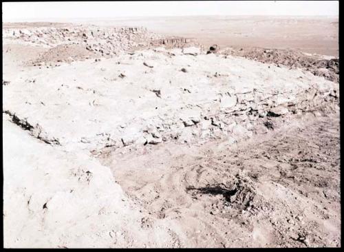 Rectangular elevated area which has been exposed by digging around it; called "citadel" in 36-38