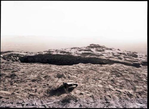 Rectangular elevated area which has been exposed by digging around it; called "citadel" in 36-38