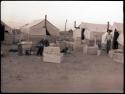 Camp, wooden boxes being readied for shipping