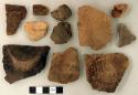 Coarse earthenware base, body, and rim sherds, some decorated; non-cultural stone fragments; worked animal bone fragment