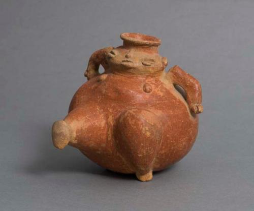 Red-slipped ceramic dancing effigy vessel