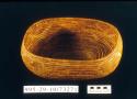 Coiled oval bowl-shaped basket with steep sides