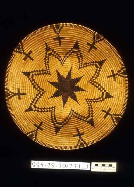 Coiled bowl with star and cross motif