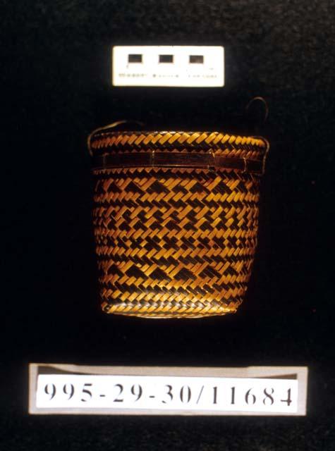 Small plaited basket with square bottom and straight sides