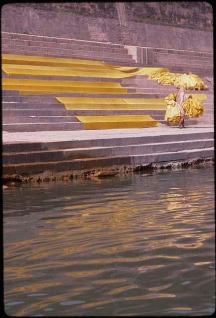 Ghats and yellow saris drying - Benares, India
