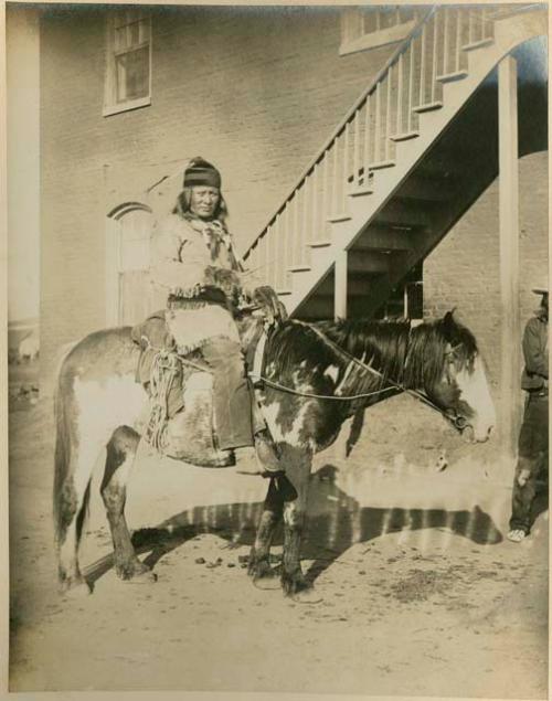 Rain in the Face on horseback