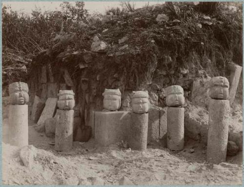 Stone heads found near corner associated with columns