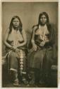 Studio photograph of two seated women