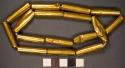 17 Gold Beads, tubular 1.3"l x 3 d.