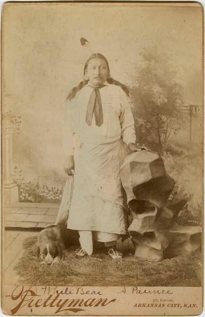 Studio photograph of White Bear with dog