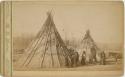 Group with horses in front of tepees