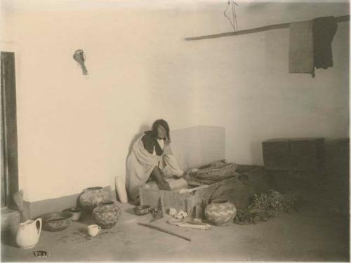 Person with ceramics on floor