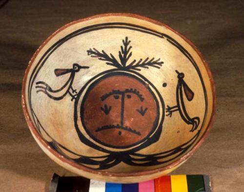 Bowl, polacca polychrome style c. int: clown design; ext: slipped, no design. 8.