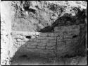 Room 229, north wall, inside adobe wall.