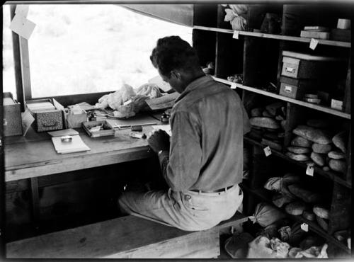 Dick Woodbury working in the stone-and-bone tent.