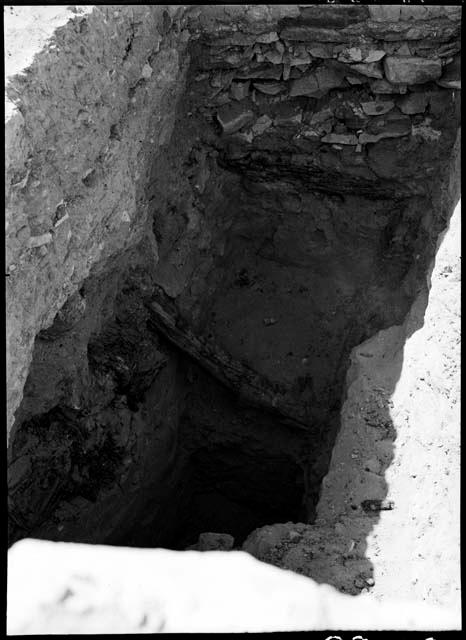 Room 908, kiva, west of Church B, showing wooden beam.