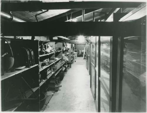 Historical photograph of Peabody Museum attic storage with various objects