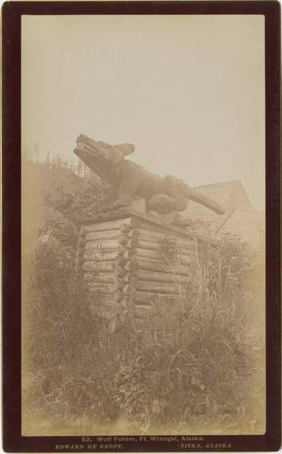 Grave in Wrangell.  Monument of a wolf.