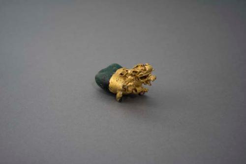 Emerald and gold animal pendant