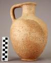 Trefoil-mouthed pottery pitcher with ring base; 2 strip handle;
