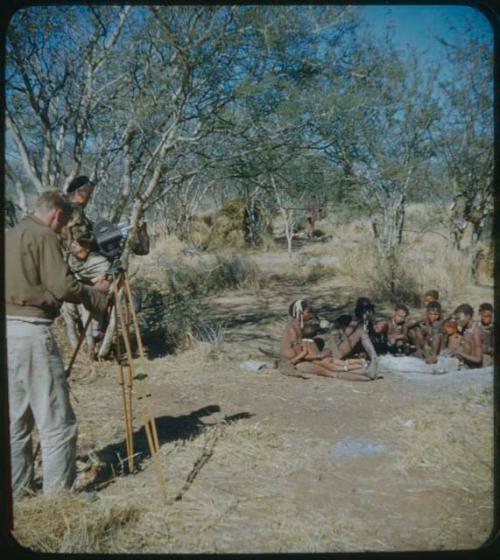 Expedition: Group of women and girls sitting, being filmed by John Marshall