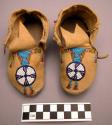 Pair of child's moccasins with bead decoration