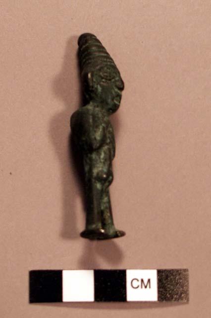 Bronze (?) male figurine; either hunchback or carrying pack