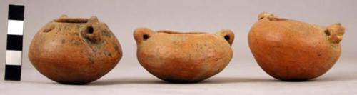 3 miniature rounded-bottom pottery vessels with handles