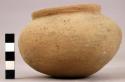 Small plain pottery vessel slightly square-shaped
