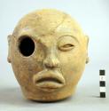 Ceramic effigy vessel with single opening on one eye