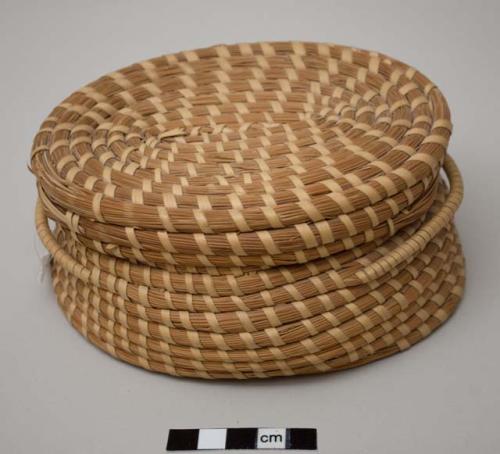 Oval covered basket with two handles