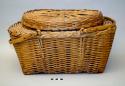 Covered picnic-style basket with two wooden handles