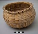 Round basket with "porcupine twist" splint feet; signed Rose Whiterabbit