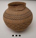 Olla-shaped basket, patterned; tears at neck