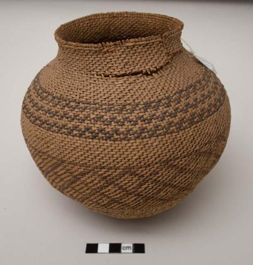 Olla-shaped basket, patterned; tears at neck