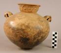 Pottery jar with 2 bird head handles that are rattles, and appliqued design arou