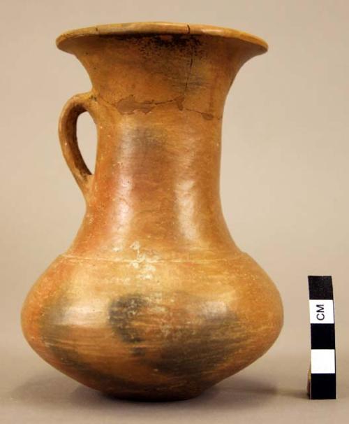 Broken tall-necked pottery vessel