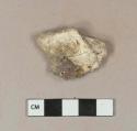 Clinker fragment with slag attached