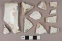 Undecorated whiteware vessel body and rim fragments, white paste