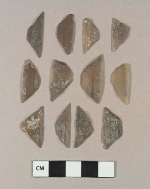 15 flint microliths of triangular and trapezoidal form